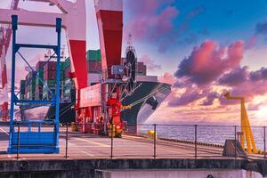 A dusk of Containers and cranes near the port in Aomi Tokyo telephoto shot photo