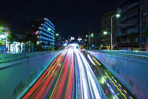 A night traffic jam at the urban street in Tokyo wide shot photo