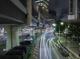 A night traffic jam at the urban street in Tokyo wide shot photo