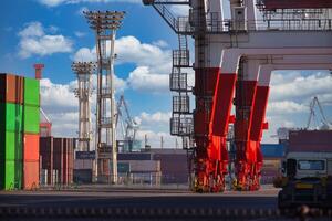 Containers and cranes near the port in Aomi Tokyo telephoto shot photo