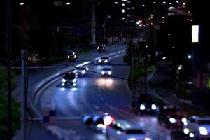 un noche miniatura tráfico mermelada a yámate avenida en tokio foto