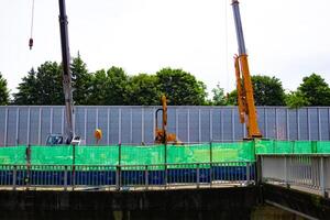 Cranes at the under construction in Tokyo photo