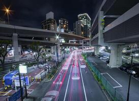 A night traffic jam at the urban street in Tokyo wide shot photo