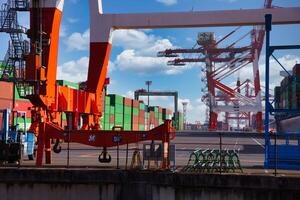 Containers and cranes near the port in Aomi Tokyo telephoto shot photo