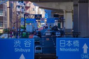 A traffic jam at the city street in Tokyo telephoto shot photo