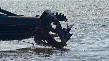 Giant Drill Absorbent Waste Dredger Preparing to Clean Hardened Muddy Garbage Remains in the Sea Footage. video