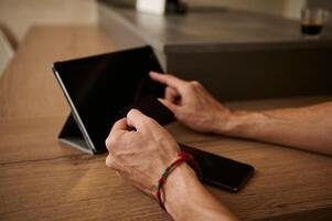 Hands using digital tablet for online shopping, receiving or making payments via internet mobile banking application photo