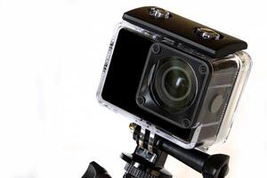 Action camera in a protected waterproof case, isolated on white photo