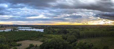 Amazing huge aerial panorama from to green countryside and a lake photo