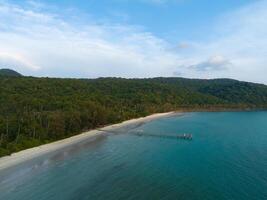 Aerial drone view of beautiful beach with turquoise sea water and palm trees of Gulf of Thailand. Kood island, Thailand photo