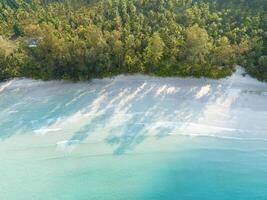 Aerial drone view of beautiful beach with turquoise sea water and palm trees of Gulf of Thailand. Kood island, Thailand photo