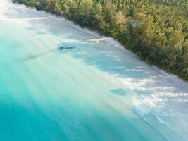 Aerial drone view of beautiful beach with turquoise sea water and palm trees of Gulf of Thailand. Kood island, Thailand photo