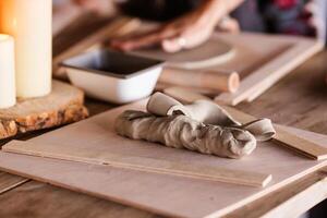 a piece of clay on the table on the workshop photo