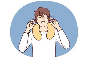 Happy man uses earplugs and neck pillow to rest during long journey on bus or plane vector