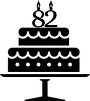 A black-and-white image of a cake with the number 82 on it. vector