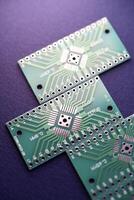 Green printed circuit boards for soldering radio components.  A set for a beginner amateur radio operator. photo