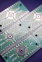 Green printed circuit boards for soldering radio components.  A set for a beginner amateur radio operator. photo