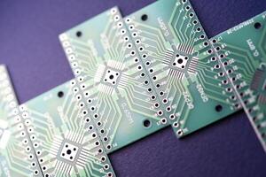 Green printed circuit boards for soldering radio components.  A set for a beginner amateur radio operator. photo