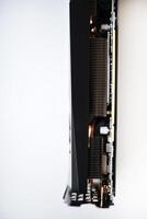 The case of the video card on a white background. A device for a computer. The radiator of the video card. photo