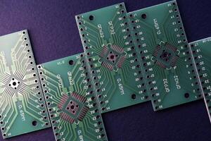 Green printed circuit boards for soldering radio components.  A set for a beginner amateur radio operator. photo
