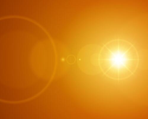 Orange Abstract Background With Lens Flare Effect