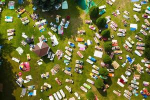 Top view of the summer recreation area for people with sun beds outside in sunny weather photo