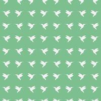 Seamless pattern of flying Hummingbirds from the side. White silhouette of a bird in profile on a green background. Tropical and exotic fauna. Animal shape. Vector illustration.