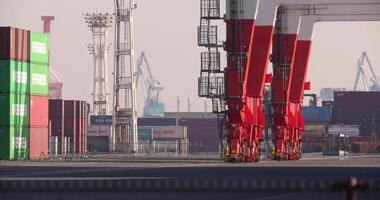 Containers and cranes near the port in Aomi Tokyo telephoto shot video