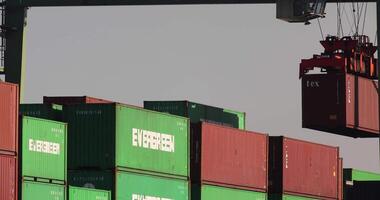 Containers and cranes near the port in Aomi Tokyo telephoto shot video