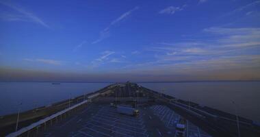 A dusk traffic jam on the highway at Tokyo bay area in Chiba super wide shot tilt down video