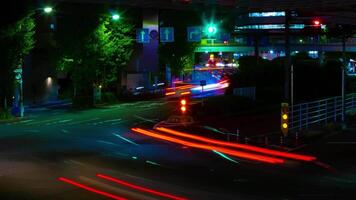 A night timelapse of the traffic jam at the downtown street in Tokyo tilt video