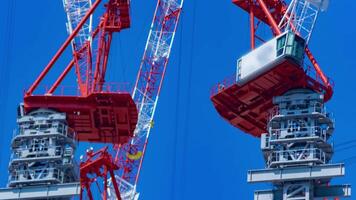 A timelapse of crane at the under construction daytime long shot panning video