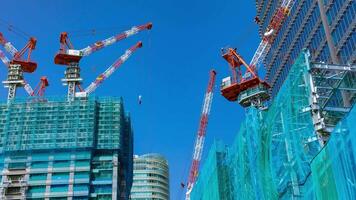 A timelapse of crane at the under construction daytime panning video