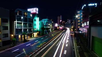 A night timelapse of the traffic jam at the urban city street wide shot zoom video