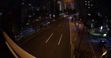 A night traffic jam at the city crossing in Tokyo fish-eye shot video