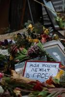 Berlin, Germany. March, 3rd, 2024. Navalny spontaneous memorial with lots of flowers, candles, photos in front of Embassy of Russian Federation after the death of Russian politician Alexei Navalny.