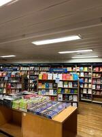 Herceg-Novi, Montenegro - 17 august 2023. Shelving with colorful books on management in a store photo