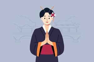 Geisha woman in traditional japanese kimono makes konishua gesture while standing near park vector