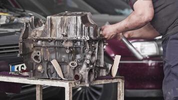 Preparation for Repair of Car Engine on the Workbench Footage. video