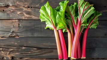 AI generated Freshly harvested rhubarb stalks arranged neatly on a rustic wooden table, creating a background with empty space for text about the rhubarb cultivation process photo