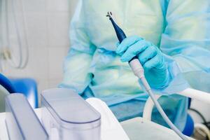 Ultrasonic scaler in the dental office. Dentistry Concept photo