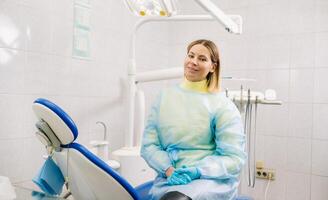 a female dentist sits in her dental office after work photo