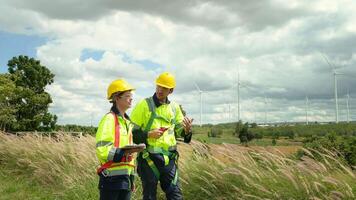 people engineer are wearing a protective helmet on head, using tablet Analytics engineering data video