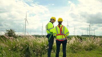 people engineer are wearing a protective helmet on head, using tablet Analytics engineering data video