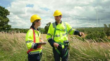 people engineer are wearing a protective helmet on head, using tablet Analytics engineering data video