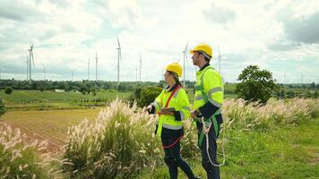 people engineer are wearing a protective helmet on head, using tablet Analytics engineering data video