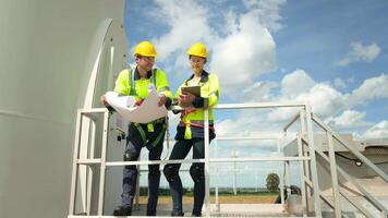 people engineer are wearing a protective helmet on head, using tablet Analytics engineering data video