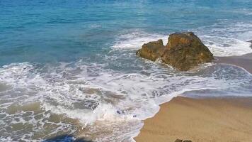 Beautiful rocks cliffs surfer waves at beach Puerto Escondido Mexico. video