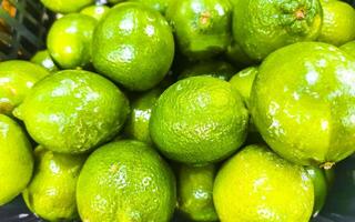 Juicy green lime lemon citrus fruit fruits supermarket Mexico. photo
