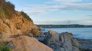 Surfer waves turquoise blue water rocks cliffs boulders Puerto Escondido. video